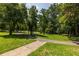Beautiful community park featuring lush green grass and tree lined sidewalks at 1225 Church St # M, Decatur, GA 30030