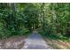 Serene walking path surrounded by lush greenery and tall trees at 1225 Church St # M, Decatur, GA 30030