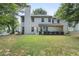 Backyard featuring a well-maintained lawn and a two-story beige house at 2683 Berry Ridge Ct, Buford, GA 30519