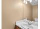 This half bathroom features a single sink, classic fixtures, and good lighting at 2683 Berry Ridge Ct, Buford, GA 30519