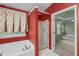 Bathroom featuring separate tub and shower, window with curtains, and access to bedroom at 2683 Berry Ridge Ct, Buford, GA 30519