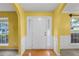 Inviting entryway with hardwood floors and white trim, leading into the home at 2683 Berry Ridge Ct, Buford, GA 30519