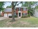 Charming two-story brick home featuring a two-car garage and well-manicured front lawn at 2683 Berry Ridge Ct, Buford, GA 30519