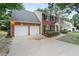 Lovely home showcasing a spacious driveway leading to an attached two-car garage at 2683 Berry Ridge Ct, Buford, GA 30519