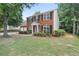 Beautiful red brick home with black shutters, complemented by a lush green lawn at 2683 Berry Ridge Ct, Buford, GA 30519