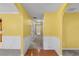 Bright hallway featuring hardwood floors transitioning to carpet, creating a warm welcome at 2683 Berry Ridge Ct, Buford, GA 30519