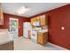 Cozy kitchen features matching appliances, cabinetry, and bright overhead lighting at 2683 Berry Ridge Ct, Buford, GA 30519