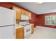 Charming kitchen features ample cabinet space, a gas range, and a window for natural light at 2683 Berry Ridge Ct, Buford, GA 30519