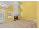 Spacious living room boasting a fireplace, plenty of natural light, and a door to the yard at 2683 Berry Ridge Ct, Buford, GA 30519