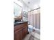Traditional bathroom featuring granite counters and a shower with curtain at 2283 Falmouth Se Ct # 22, Smyrna, GA 30080