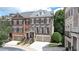Elegant townhome with brick facade, attached garages, and well-maintained landscaping at 2283 Falmouth Se Ct # 22, Smyrna, GA 30080
