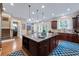 Beautiful kitchen with dark wood cabinets, granite island, and eat in kitchen perfect for casual dining at 2283 Falmouth Se Ct # 22, Smyrna, GA 30080