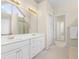 Bathroom with double vanity, framed mirror and lighting at 3053 Ramsey Pl, Marietta, GA 30062
