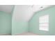 Bright bedroom with an angled ceiling, a window and light green walls at 3053 Ramsey Pl, Marietta, GA 30062