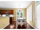 Bright breakfast nook featuring hardwood floors, a chandelier, and access to the outdoor patio at 3053 Ramsey Pl, Marietta, GA 30062