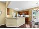 Open kitchen with granite countertops, stainless steel appliances, hardwood floors, and a breakfast bar at 3053 Ramsey Pl, Marietta, GA 30062