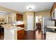 Well-equipped kitchen with granite countertops, stainless steel appliances, and dark wood cabinetry at 3053 Ramsey Pl, Marietta, GA 30062