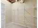 Unfinished storage space with wire shelving, white shelving, and carpeted floors at 3053 Ramsey Pl, Marietta, GA 30062