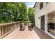 Inviting back deck with outdoor seating, perfect for enjoying the tranquil, wooded surroundings at 321 Crabtree Court, Marietta, GA 30068