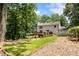 Expansive backyard featuring a deck, patio, lush lawn, and garden at 321 Crabtree Court, Marietta, GA 30068