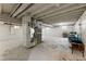 Unfinished basement offering potential for customization, with exposed ductwork and painted walls at 321 Crabtree Court, Marietta, GA 30068