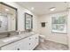 Bathroom featuring double sinks with marble countertops, and a shower-tub featuring marble tiling at 321 Crabtree Court, Marietta, GA 30068
