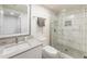 Modern bathroom with glass-enclosed shower featuring sleek tile, vanity with sink, and contemporary fixtures at 321 Crabtree Court, Marietta, GA 30068