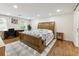 Spacious bedroom with hardwood floors, office space, desk and a bed with a blue and white patterned comforter at 321 Crabtree Court, Marietta, GA 30068