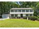 Classic two-story home with navy shutters, green lawn and a well manicured front yard at 321 Crabtree Court, Marietta, GA 30068