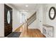 Foyer with hardwood flooring, decorative front door, staircase with iron spindles and view to additional rooms at 321 Crabtree Court, Marietta, GA 30068