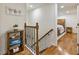 Hallway with wood floors and a view to a bedroom with a bed, wood furniture and natural light at 321 Crabtree Court, Marietta, GA 30068