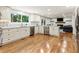 The eat-in kitchen has custom cabinets, stainless appliances, and views to the living room at 321 Crabtree Court, Marietta, GA 30068