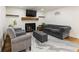 Living room featuring a fireplace, modern decor, and plush seating at 321 Crabtree Court, Marietta, GA 30068