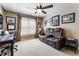 Comfortable bonus room with a recliner sofa, desk, and memorabilia; perfect for relaxation and entertainment at 35 Westfair Ct, Atlanta, GA 30328