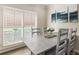 Dining room featuring a distressed wood table, seating for six, and plantation shutters at 35 Westfair Ct, Atlanta, GA 30328