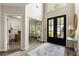 Grand foyer featuring high ceilings, hardwood floors, and a large front door at 35 Westfair Ct, Atlanta, GA 30328