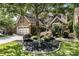 Charming two-story brick home featuring a well-manicured front yard and a two car garage at 35 Westfair Ct, Atlanta, GA 30328