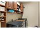 Functional laundry room boasts overhead cabinets and modern washer and dryer units at 35 Westfair Ct, Atlanta, GA 30328
