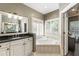 Modern main bathroom boasts a soaking tub, double sink vanity, and shutters at 35 Westfair Ct, Atlanta, GA 30328