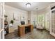 Well-lit office space with hardwood floors, a desk, and plenty of windows at 35 Westfair Ct, Atlanta, GA 30328