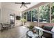 Cozy sunroom with tile floors, a ceiling fan, and a wall of windows at 35 Westfair Ct, Atlanta, GA 30328
