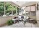 Cozy sunroom with ample natural light, neutral decor, and outdoor views at 35 Westfair Ct, Atlanta, GA 30328
