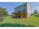 Back exterior with an expansive back deck perfect for outdoor entertaining and relaxing at 4445 Hager Ct, Cumming, GA 30040