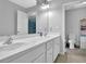 Bright bathroom featuring a double vanity with white cabinets and modern fixtures at 4445 Hager Ct, Cumming, GA 30040