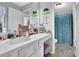Bathroom featuring vanity, framed mirrors and separate toilet and shower area at 4445 Hager Ct, Cumming, GA 30040