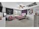 Cozy bedroom features carpeted floors, ceiling fan, and a window with natural light at 4445 Hager Ct, Cumming, GA 30040