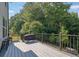 Spacious back deck perfect for outdoor dining and grilling overlooking beautiful mature trees at 4445 Hager Ct, Cumming, GA 30040