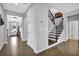 Welcoming foyer with hardwood floors, staircase and a view of the front door at 4445 Hager Ct, Cumming, GA 30040
