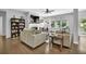 Cozy living room with a fireplace, large windows, and comfortable seating at 4445 Hager Ct, Cumming, GA 30040