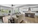 Spacious living room with hardwood floors, large windows, and a view of the kitchen at 4445 Hager Ct, Cumming, GA 30040